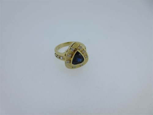Lot 223 - A modern 18ct gold sapphire and diamond ring
