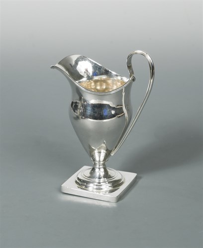 Lot 411 - A George V silver helmet cream jug
