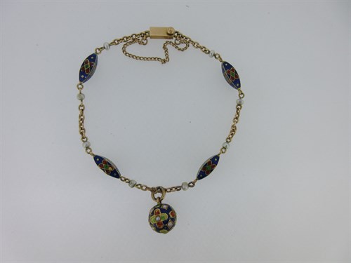 Lot 46 - An enamel and seed pearl chain and pendant bracelet