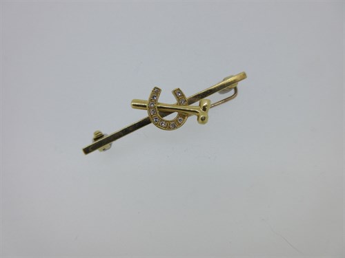 Lot 153 - An 18ct gold and diamond farrier's brooch