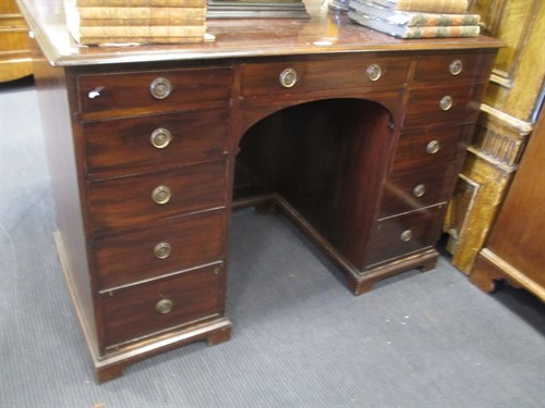 Lot 582 - A George III style mahogany kneehole pedestal...