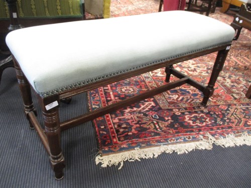 Lot 587 - An Edwardian mahogany long stool, with...