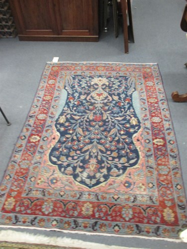 Lot 742 - A Tabriz rug, with florals on a blue ground...