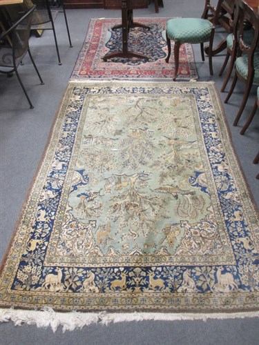 Lot 741 - A modern Persian rug, with armorials, birds...