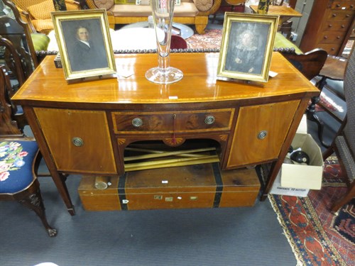 Lot 579 - A George III style bowfronted sideboard 136 cm...