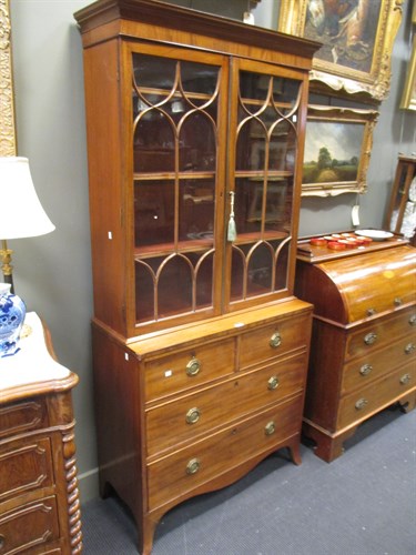 Lot 341 - A George III mahogany glazed bookcase on chest...