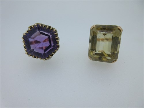 Lot 20 - An amethyst dress ring and a similar citrine ring