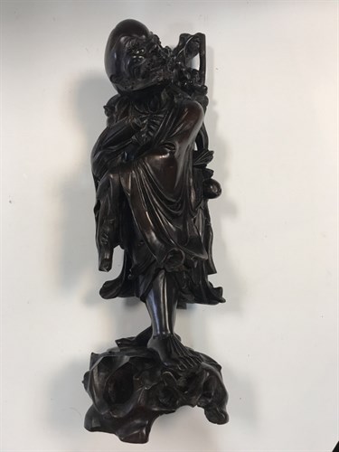 Lot 12 - Three Chinese rosewood figures, Late Qing...