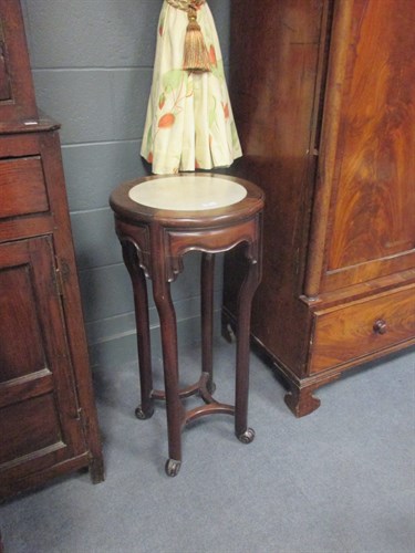 Lot 709 - A pair of Chinese marble-topped tables, 85cm high