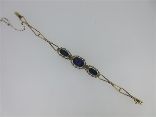 Lot 89 - A black opal doublet bracelet stamped '10k'