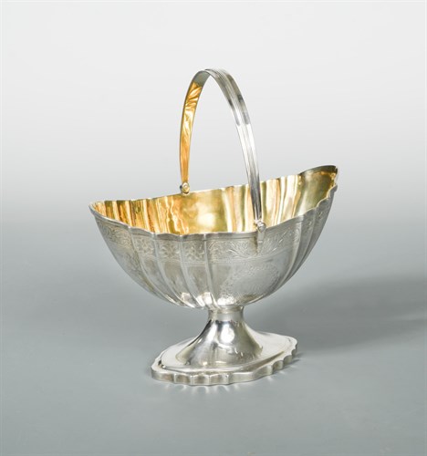 Lot 444 - Edinburgh - A George III silver swing handled sugar basket