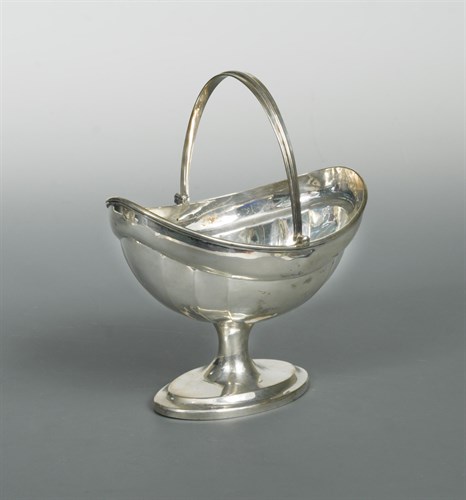 Lot 454 - Dublin - A George III silver swing handled sugar basket