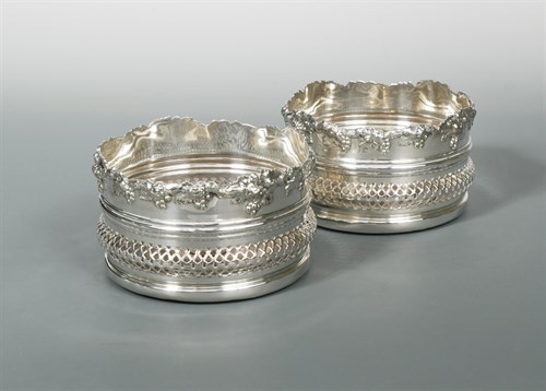 Lot 284 - A pair of Victorian high sided silver plated bottle coasters