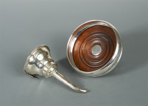Lot 432 - A 20th century silver wine funnel and bottle coaster