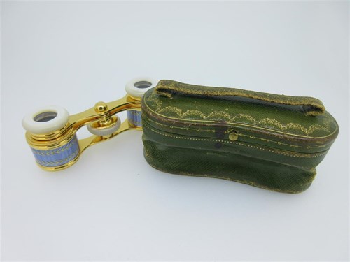 Lot 216 - Cartier - an antique case for opera glasses by Cartier, with associated pair of enamel and mother-of-pearl glasses