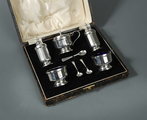 Lot 409 - A George V silver five piece condiment set