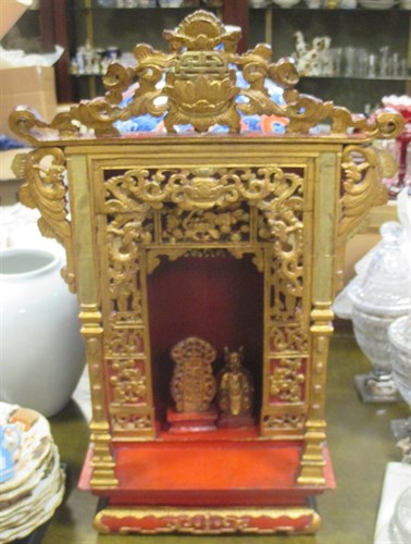 Lot 131 - A carved giltwood Oriental shrine with small...