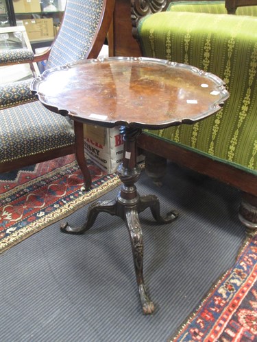 Lot 576 - A George III style carved mahogany tripod wine...