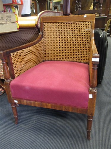 Lot 600 - An Edwardian mahogany and cane-work armchair,...