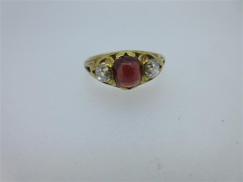 Lot 67 - An early Victorian diamond and spessartine garnet three stone ring with 1841 memorial inscription inside