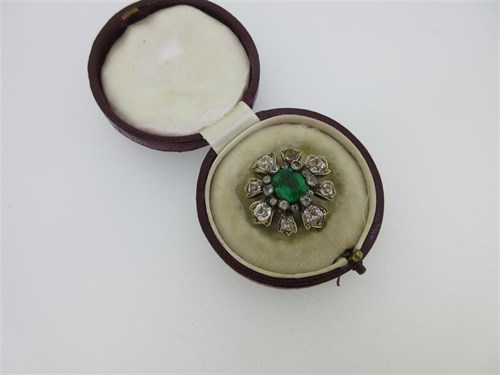 Lot 110 - A 19th century green paste and white paste brooch