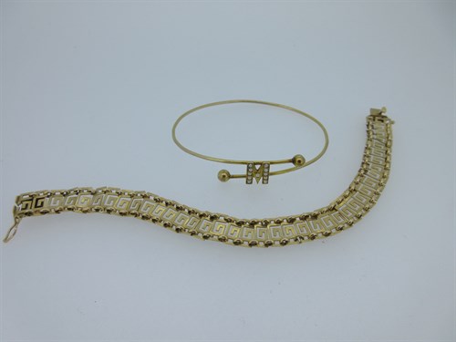 Lot 79 - A greek key pattern bracelet and a wire bangle with seed pearl initial