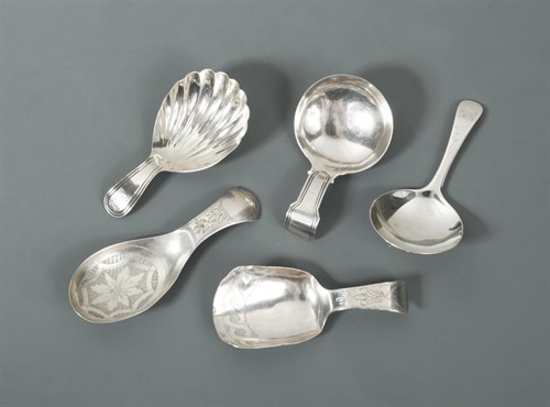 Lot 348 - A collection of four George III and one George IV silver caddy spoons