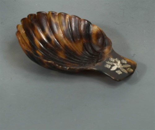 Lot 282 - A 19th Century pique tortoiseshell caddy spoon