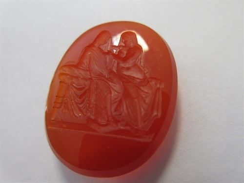 Lot 119 - A loose intaglio carved cornelian depicting classical figures