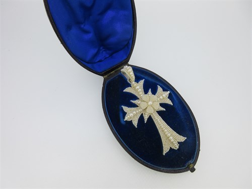 Lot 47 - A Victorian seed pearl work pendant cross