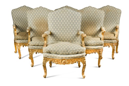 Lot 591 - A set of six early 19th century German giltwood open armchairs