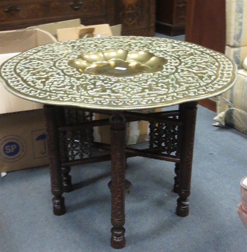 Lot 699 - An Indian brass and carved hardwood folding...