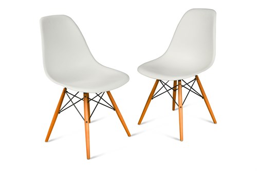 Lot 305 - Charles and Ray Eames, a pair of modern Vitra shell chairs