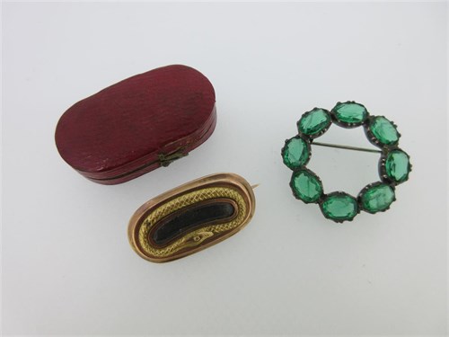 Lot 230 - A Georgian snake lace pin together with a vintage green paste hoop brooch