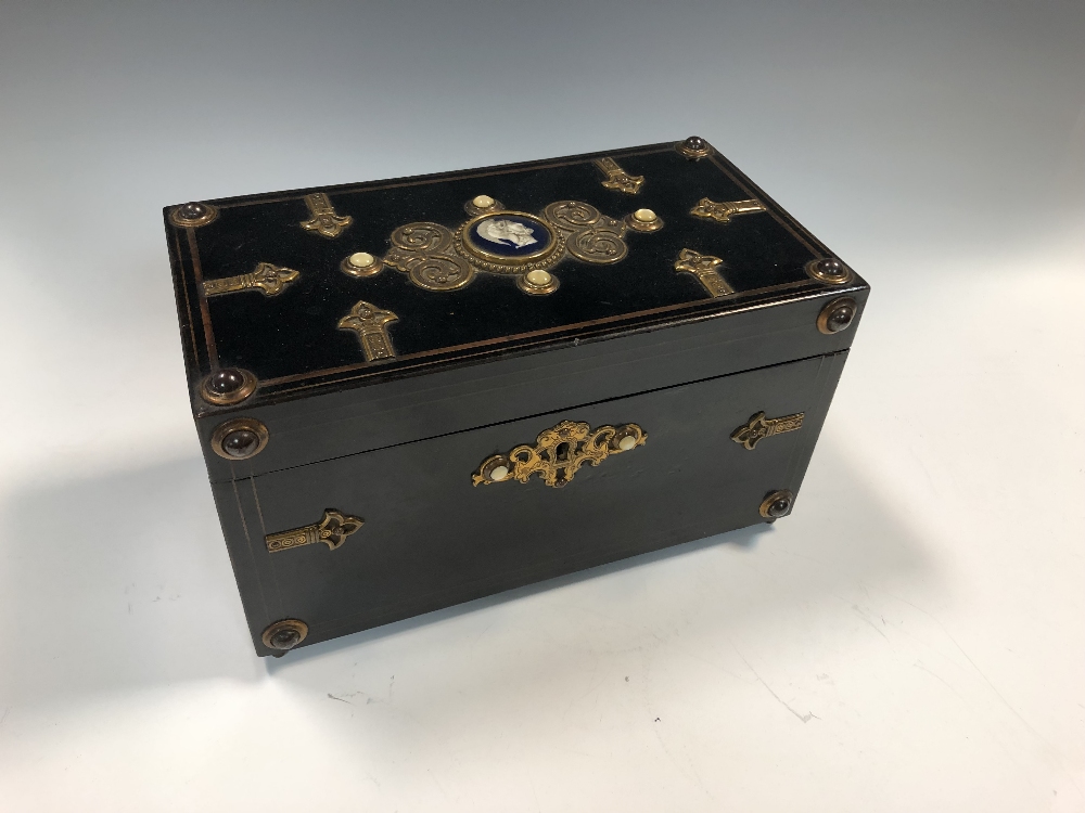 Lot 9 - A Victorian ebonised teacaddy, of rectangular...