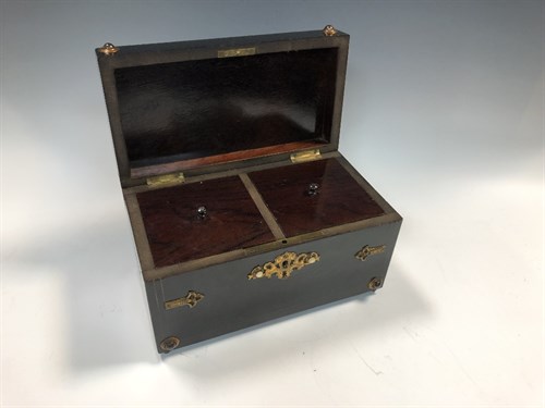 Lot 9 - A Victorian ebonised teacaddy, of rectangular...