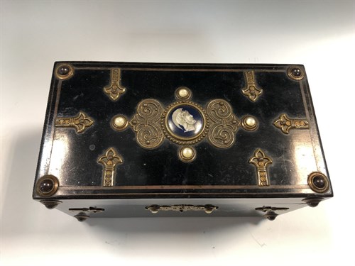 Lot 9 - A Victorian ebonised teacaddy, of rectangular...