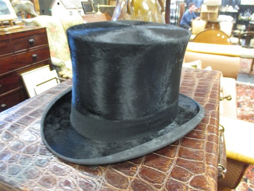 Lot 111 - A leather hat box with top hat, and a riding...
