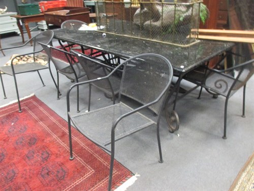 Lot 715 - A modern iron work and granite garden table,...