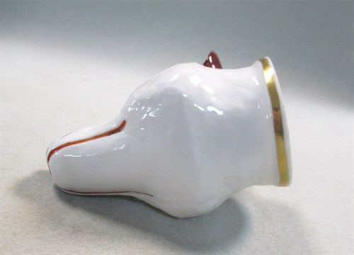 Lot 8 - A 19th century pottery fox head stirrup cup