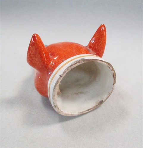 Lot 8 - A 19th century pottery fox head stirrup cup