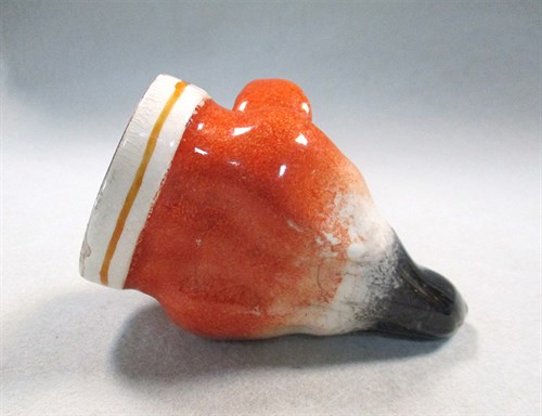 Lot 8 - A 19th century pottery fox head stirrup cup