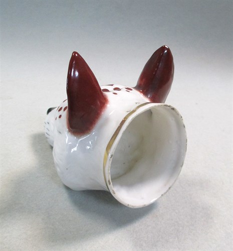 Lot 8 - A 19th century pottery fox head stirrup cup