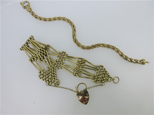 Lot 180 - A 9ct gold fancy link bracelet together with a 9ct gold gatelink bracelet