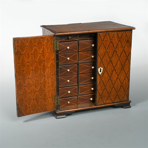 Lot 395 - A 19th century marquetry inlaid oak table cabinet