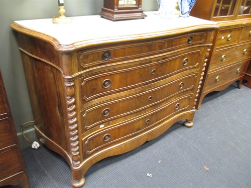 Lot 637 - A 20th century walnut serpintine marble top...