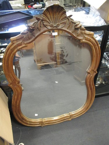 Lot 642 - A carved walnut framed mirror 108 h x 75 w cm