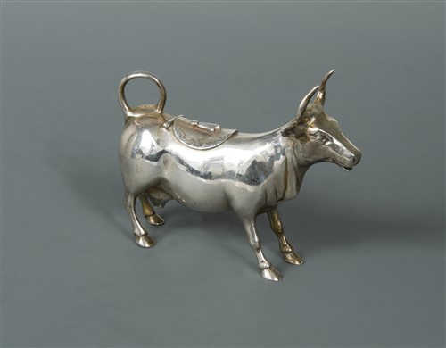 Lot 510 - A continental metalwares semi naturalistic cow creamer