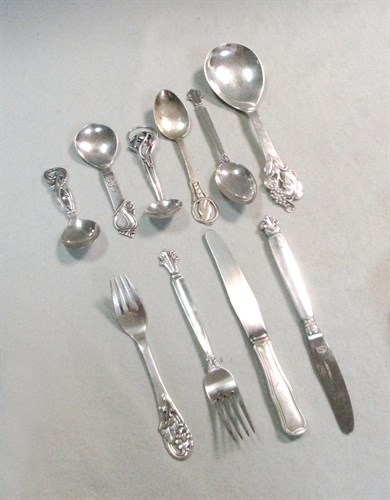 Lot 173 - A harlequin collection of 8 Art Nouveau style Danish metalwares silver spoons, with silver plated additions