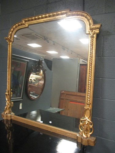 Lot 679 - A mid-Victorian gilt framed overmantle mirror...